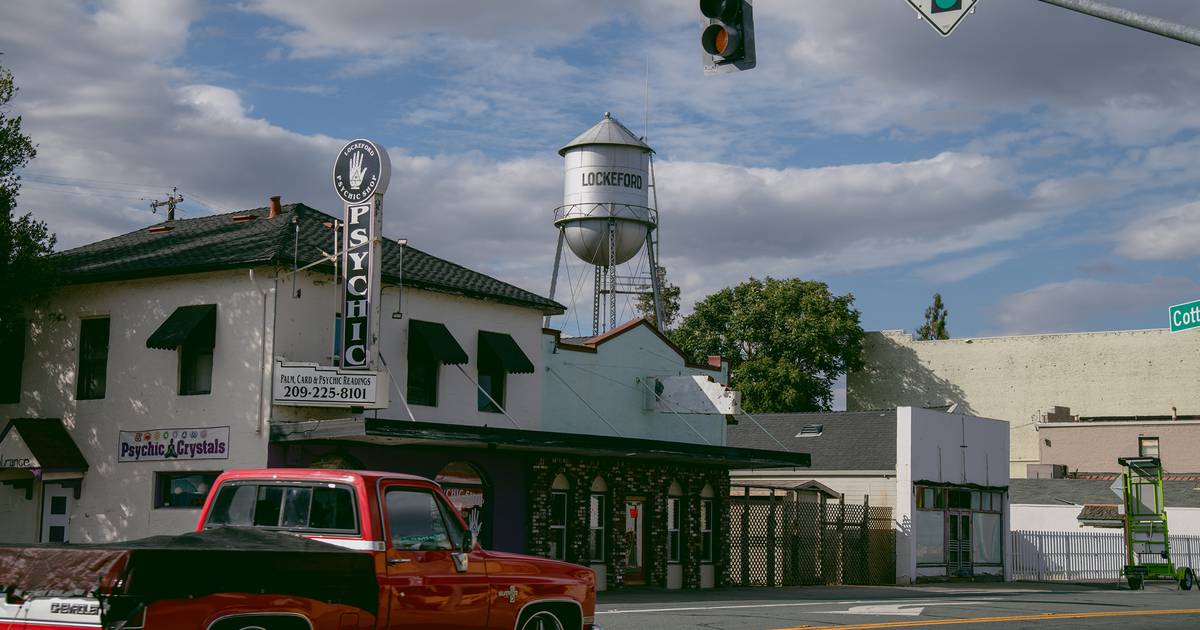 A water tower looms over downtown Lockeford, California, on June 17, 2022. (Photo for The Washington Post by Marissa Leshnov)   LOCKEFORD, Calif. - Si