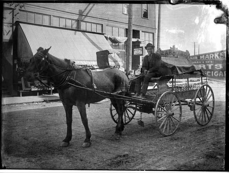A horse-drawn wagon and driver for Zarembo Mineral Springs Co., in Seattle, in 1906. (Wikimedia Commons)