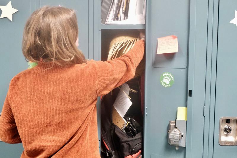High school Junior Kaitlyn Manning reaches into her locker at Ben Eielson Junior Senior High School on April 22, 2024. (Photo by Claire Stremple/Alaska Beacon)