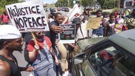 Protesters call attention to deaths of 2 more black men in U.S.