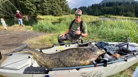 Think a kayaker needs a bigger boat to land a 186-pound halibut? Think again.