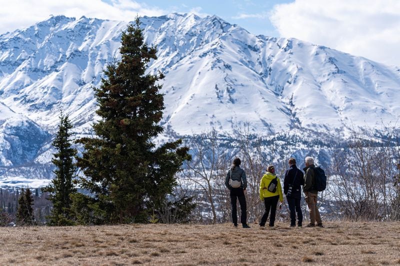 A group from the Seismological Society of America takes in the view of Matanuska Glacier during a tour of a seismic station on the playground of Glacier View School on Tuesday, April 30 in Chickaloon. (Loren Holmes / ADN)
