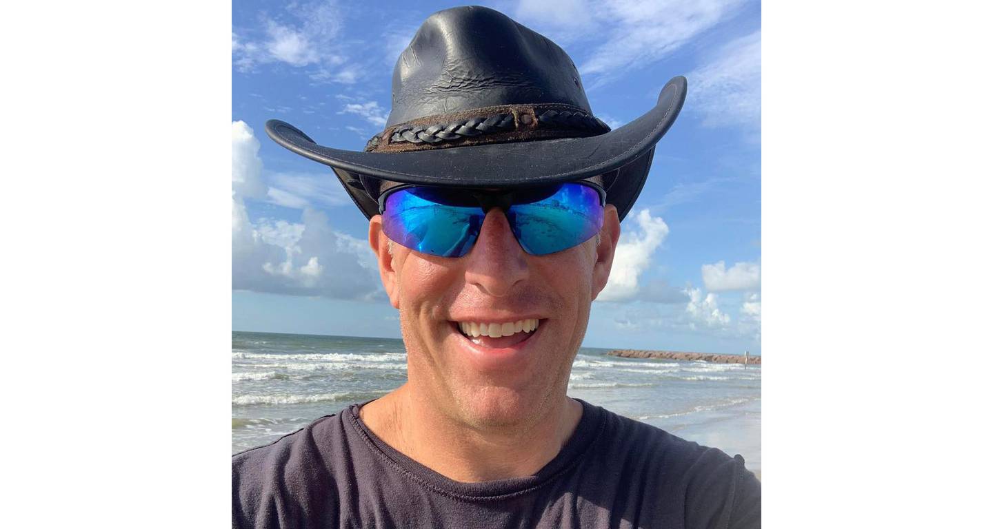 HORIZONTAL WHITE SPACE “Hurricane Hal” Needham smiles on a benign day on a Galveston, Texas, beach
