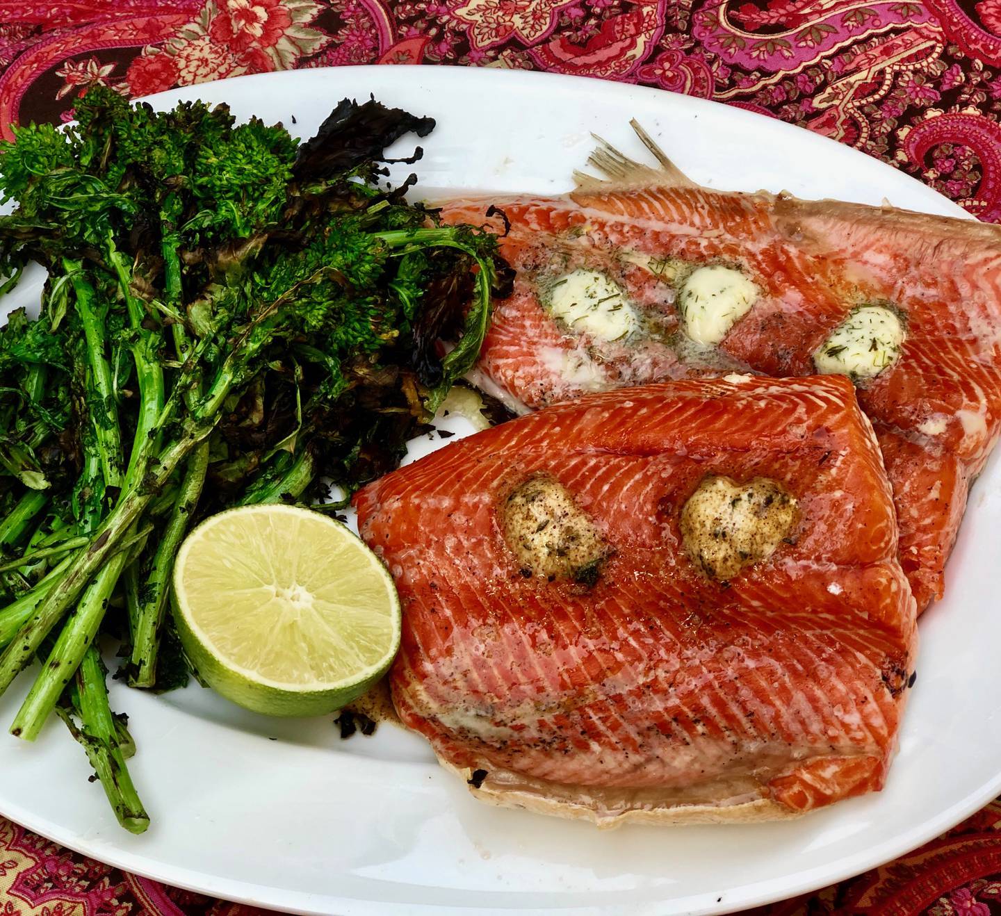 Grilled salmon topped with compound butter