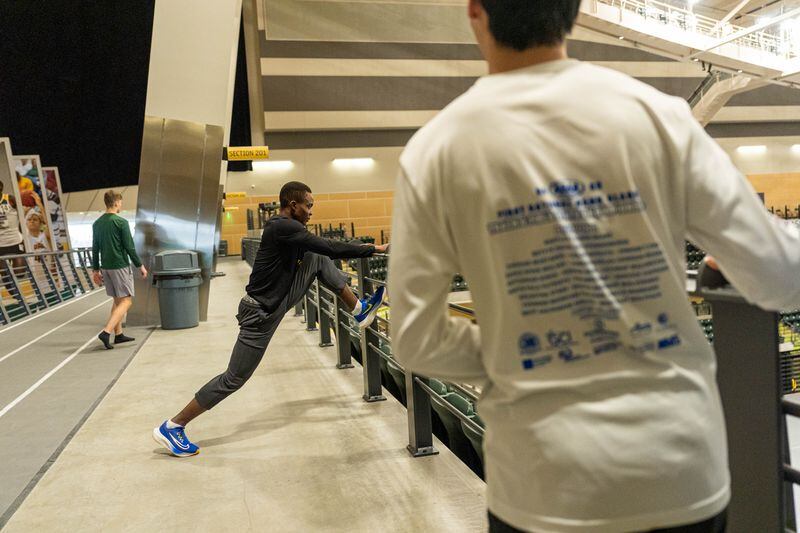 Caleb stretches after a workout on April 18 at the Alaska Airlines Center. (Loren Holmes / ADN)