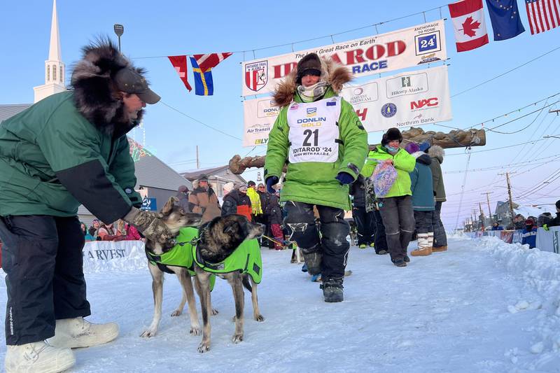 In a relay steeped in Iditarod history, Ryan Redington delivers race legend’s ashes to Nome
