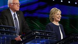 Clinton turns up heat on Sanders in sharp debate