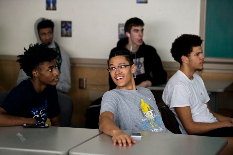 Kamaka Hepa watches game footage with his Jefferson High teammates on Feb. 15, 2018. Jefferson’s varsity boys basketball team has won the state championship five of the last 10 years, including last year with Hepa. (Marc Lester / ADN)