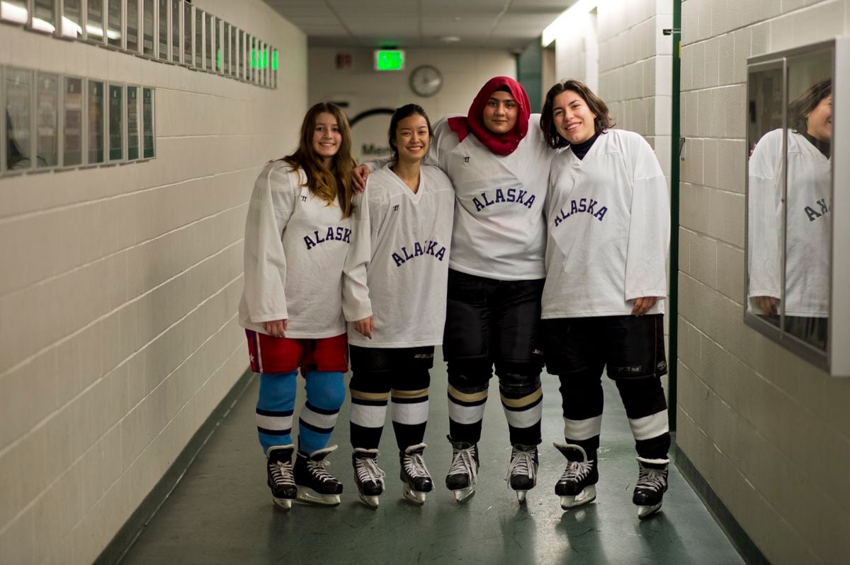 Four exchange students participated in girls junior varsity hockey this season, including, from left, Alicia Prieto of Spain, Jom Pukkanavanich of Thailand, Leena Tarar of Pakistan and Giulia Brunetta of Brazil. (Marc Lester / ADN)