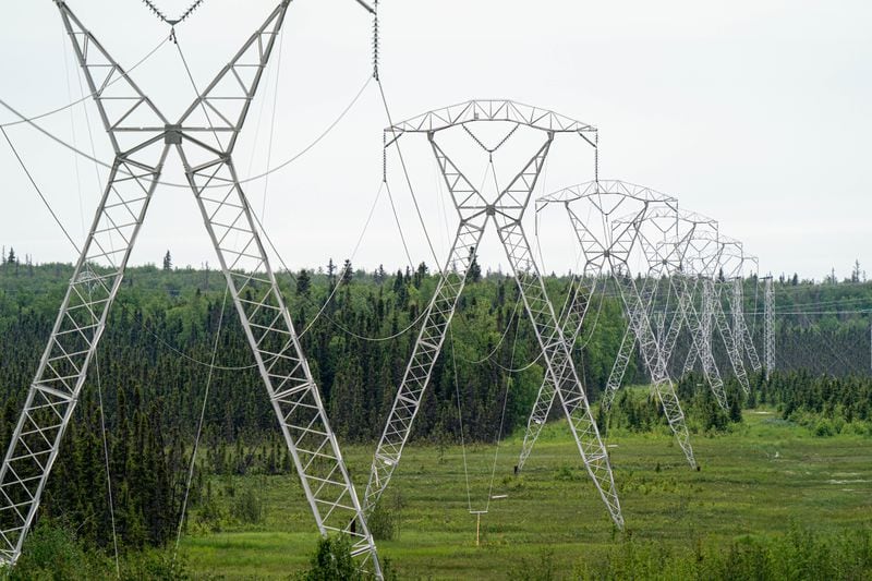 Electrical transmission lines connect the Beluga Power Plant in Tyonek with Anchorage, seen in Point MacKenzie on June 22, 2023. (Loren Holmes / ADN)