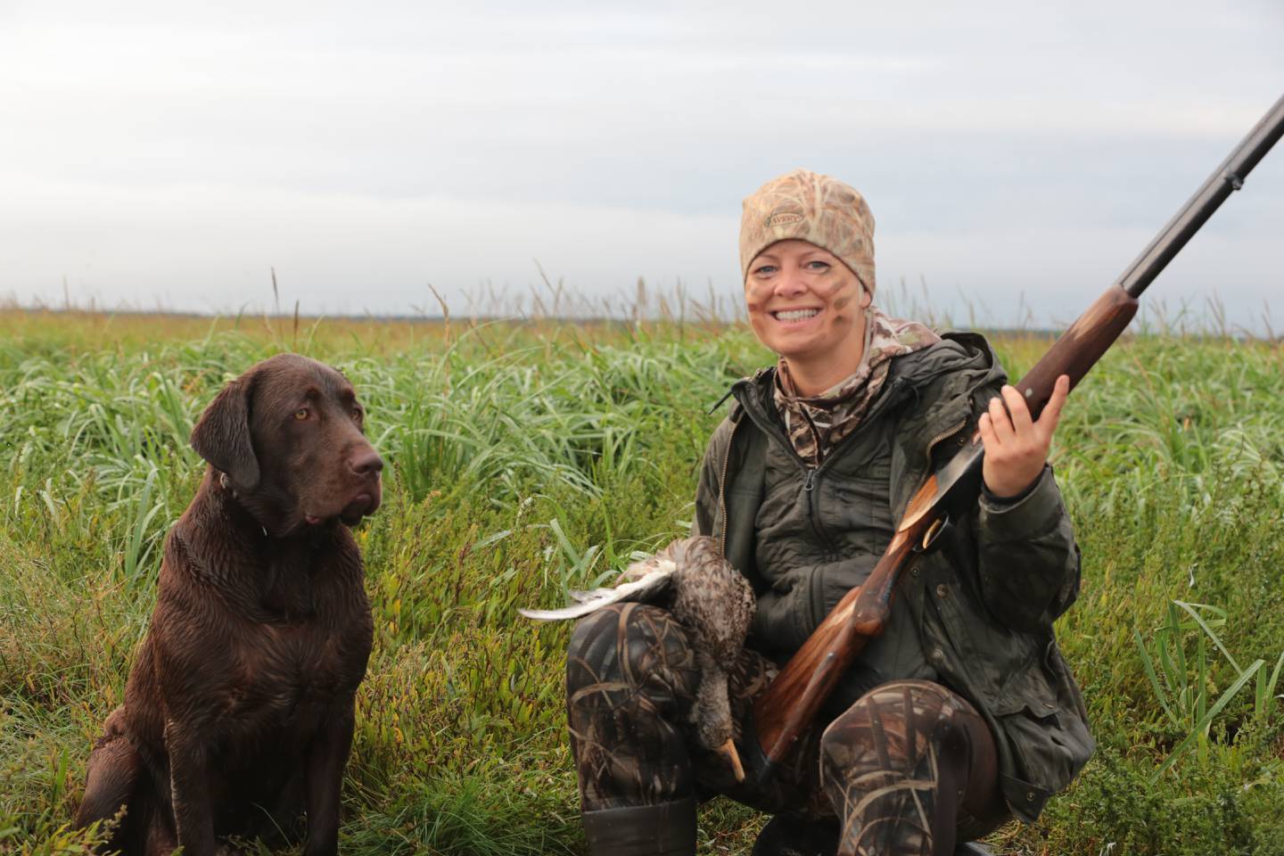 Christine Cunningham and Rigby with the first duck of the 2022 season