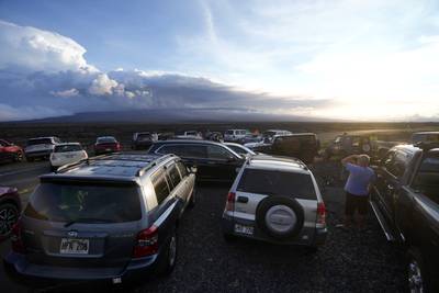 Big Island tourists and locals jam highway to watch glowing lava ooze from Mauna Loa
