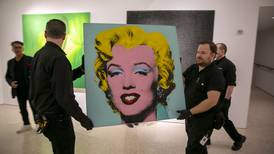 Andy Warhol portrait of Marilyn Monroe sells at auction for $195 million, a record for a US artist