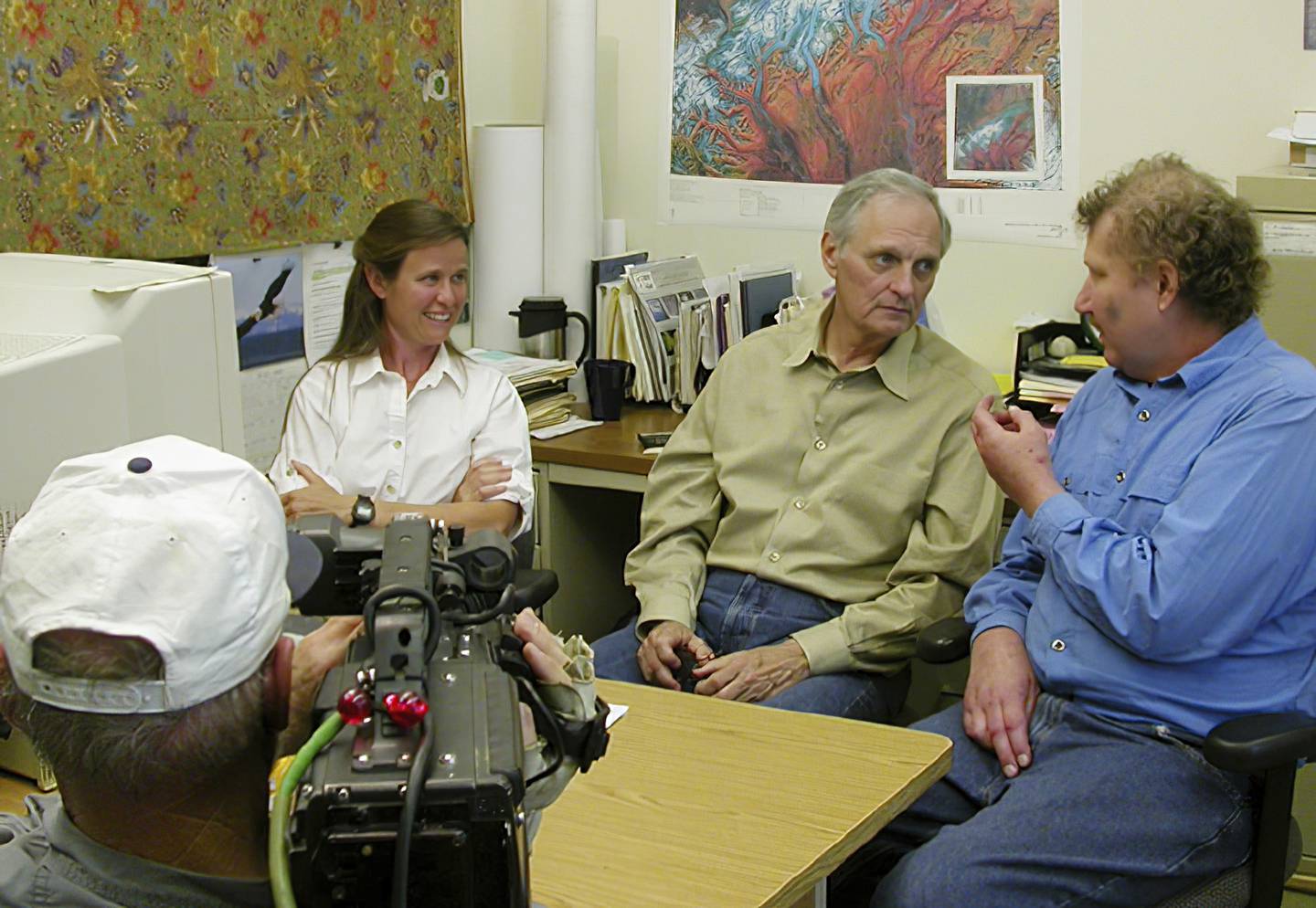 Alan Alda, center, was host of PBS’s “Scientific American Frontiers” when he visited Alaska in 2004