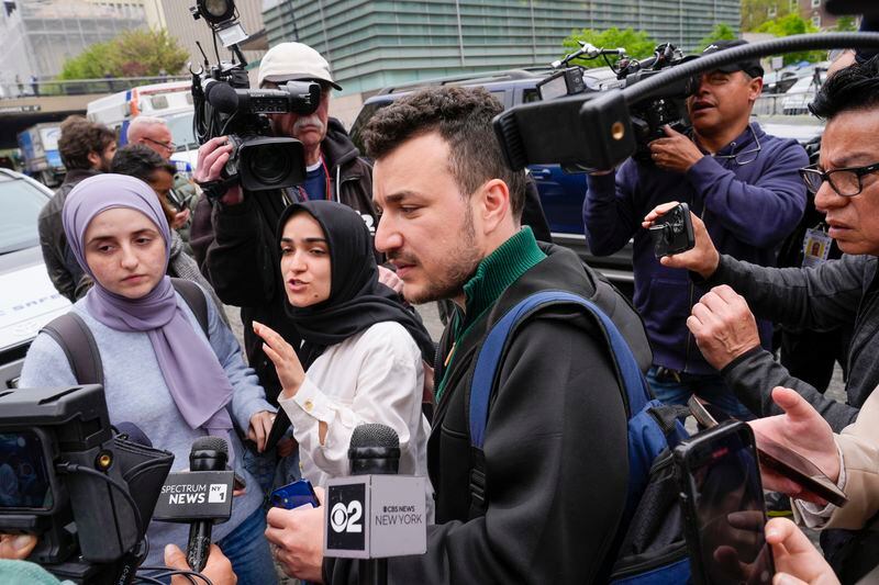 Sueda Polat, second from left, a member of Columbia University Apartheid Divest is surrounded by members of the media outside the Columbia University campus, Tuesday, April 30, 2024, in New York. (AP Photo/Mary Altaffer)