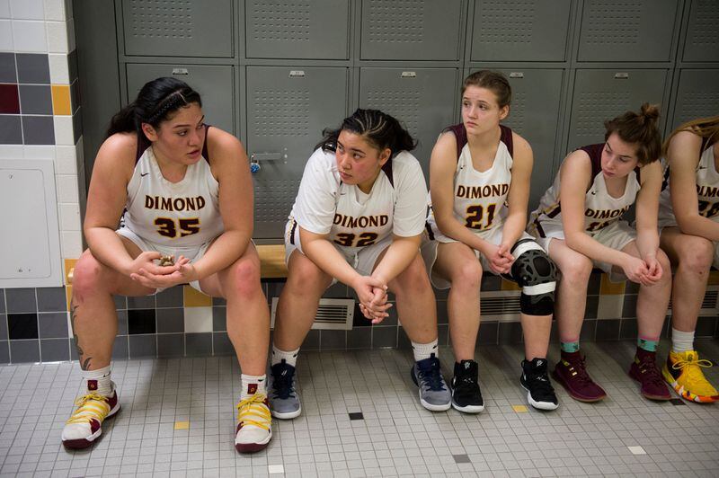 Dimond senior Alissa Pili, left, talks to her teammates in the locker room at halftime during a game on February 7, 2019. (Marc Lester / ADN)