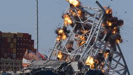 Crews use explosives to bring down Baltimore bridge span in major step toward freeing cargo ship