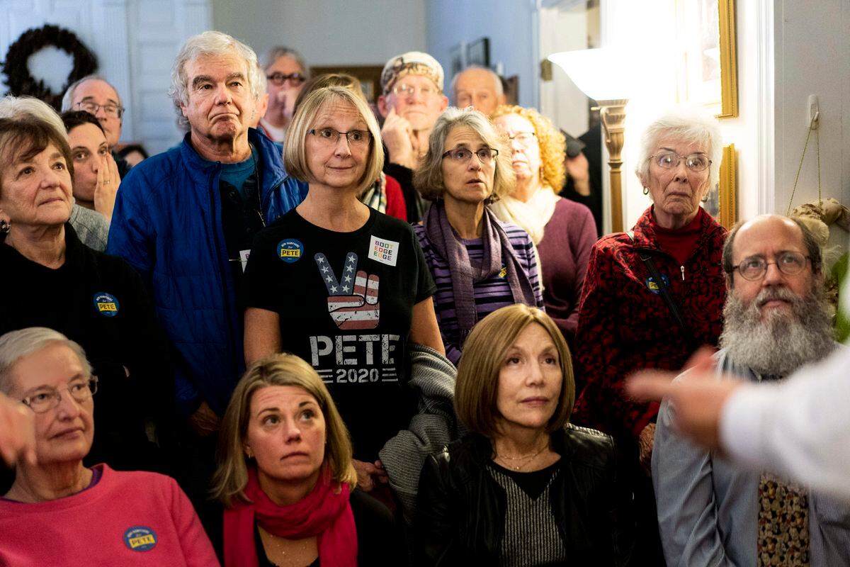 New Hampshire voters listen to Democratic presidential candidate Mayor Pete Buttigieg at a house party on Dec. 6, 2019, in Concord, N.H. MUST CREDIT: Washington Post photo by Melina Mara