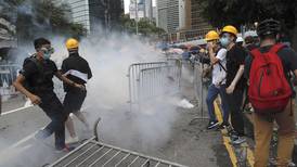 Protesters storm Hong Kong’s streets as legislature delays debate on China extradition bill
