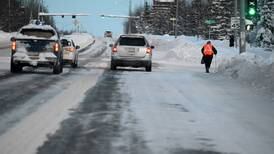 Anchorage pedestrians navigate a post-snowstorm obstacle course