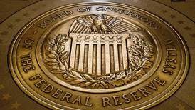Federal Reserve keeps interest rates unchanged but signals likelihood of another hike this year to fight inflation