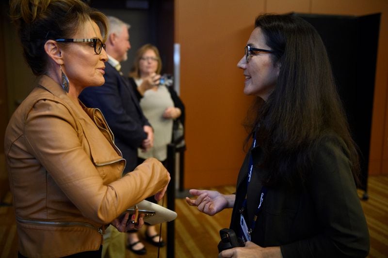 Sarah Palin and Mary Peltola on Wednesday before a U.S. House candidate forum at the Alaska Oil and Gas Association annual conference at the Dena’ina Convention Center in Anchorage. (Marc Lester / ADN)