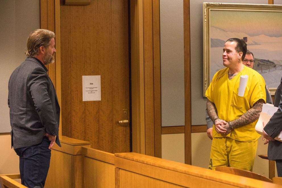 Joel Fulton, left, smiles at his brother Jason Vukovich during Vukovich’s sentencing hearing Friday. (Loren Holmes / ADN)