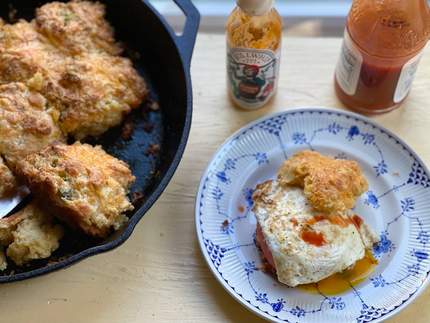 Fried egg sandwich made with cheddar jalapeño biscuits