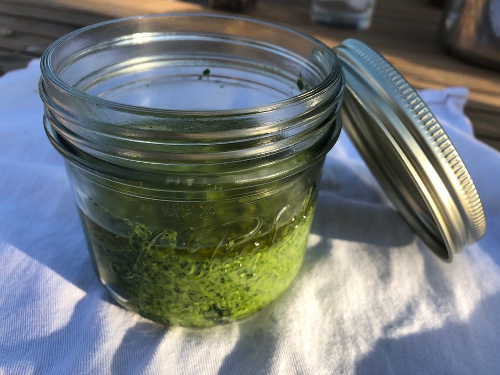 Store pesto in the fridge and keep it green by covering it with a layer of olive oil.