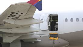 12 passengers hurt when man opens airliner door during landing in South Korea