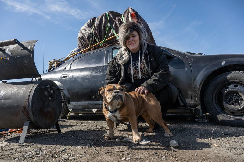 Angelica Herdeman, who had camped on land near 40th Avenue and Denali Street, packed her belongings on top of her vehicle and said she planned to leave with her dog, Diva. Herdeman said she didn’t know where she’d go next. (Marc Lester / ADN)