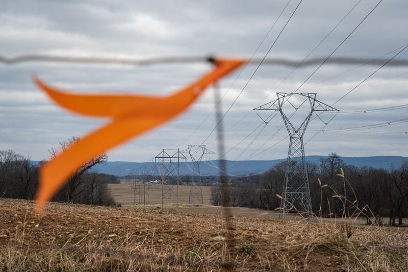 An orange marker placed by the city is seen on the property of the Gee family. (Salwan Georges/The Washington Post)
