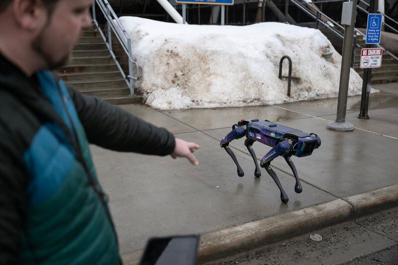 Alaska Department of Transportation program manager Ryan Marlow demonstrates a Boston Dynamics robotic dog on March 26, 2024, in Anchorage. DOT is testing the robot for future use in wildlife mitigation at Fairbanks International Airport. (Marc Lester / ADN)