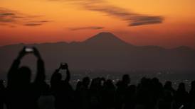 Japan, famously polite, struggles to cope with influx of tourists