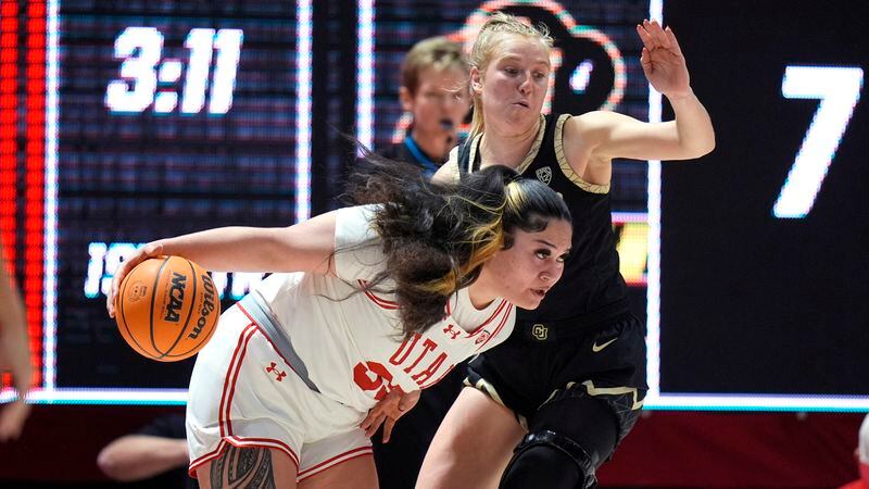 Utah forward Alissa Pili (35) drives as Colorado guard Maddie Nolan defends during the first half of an NCAA college basketball game Friday, Feb. 16, 2024, in Salt Lake City. (AP Photo/Rick Bowmer)