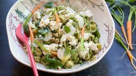 Maximize the freshness of the season with this pasta salad featuring carrot tops, chickpeas and mozzarella