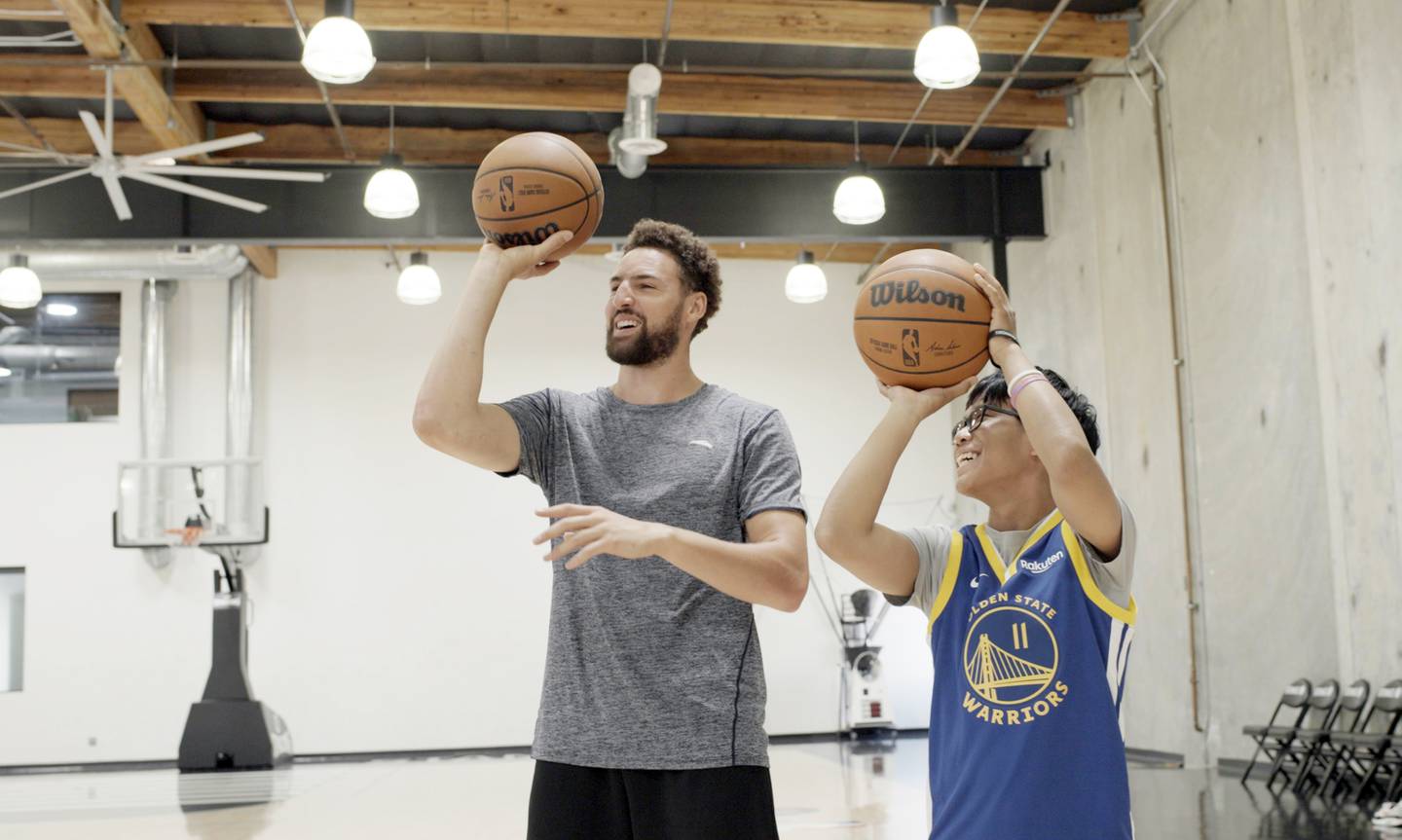 Golden State all-star Klay Thompson puts up some shots with Joseph Tagaban
