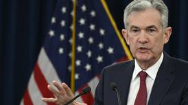 Fed lifts rates for 4th time this year but sees fewer hikes next year