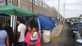 Some asylum seekers forced to wait in Mexico help each other 
