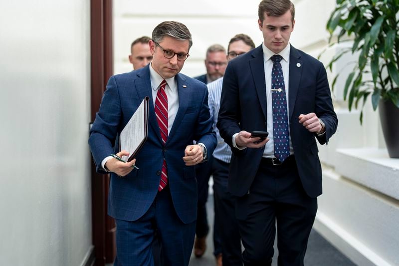 House Speaker Mike Johnson, R-La., left, arrives for a closed-door meeting with fellow Republicans at the Capitol in Washington, Monday, April 15, 2024. (AP Photo/J. Scott Applewhite)