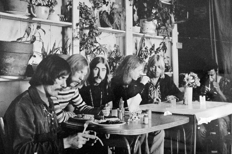 FILE - This undated photo shows members of the Allman Brothers Band, from left, Dickey Betts, Duane Allman, Berry Oakley, Butch Trucks, Gregg Allman and Jai Johanny "Jaimoe" Johanson, eating at the H&H; Restaurant in downtown Macon, Ga. (The Macon Telegraph via AP, File)