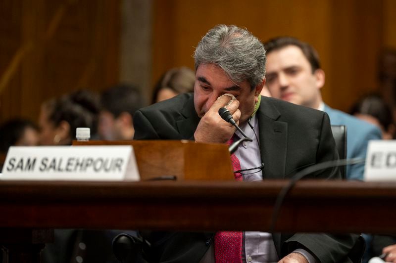 Boeing Quality Engineer Sam Salehpour wipes his eyes during a Senate Homeland Security and Governmental Affairs - Subcommittee on Investigations hearing to examine Boeing's broken safety culture on Wednesday, April 17, 2024, in Washington. (AP Photo/Kevin Wolf)
