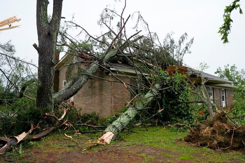 A storm damaged house is seen along Blackburn Lane, Thursday, May 9, 2024, in Columbia, Tenn. (AP Photo/George Walker IV)