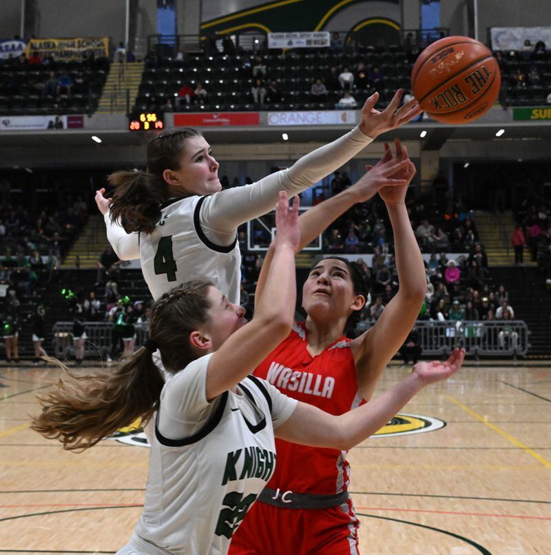 Jericho Wuestenberg (4) and Hallie Clark, of Colony and Katie Jackson, of Wasilla, go for the ball in the 4A girls state basketball championship game at the Alaska Airlines Center in Anchorage on Saturday, March 23, 2024. Wasilla won 35-32. (Bob Hallinen Photo)