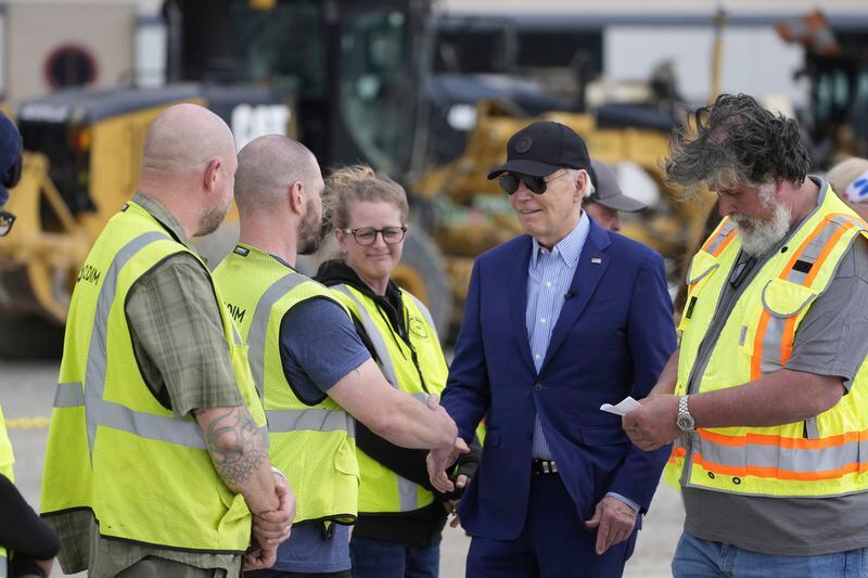 President Joe Biden speaks with construction workers as he arrives to depart on Air Force One from Pittsburgh International Airport, Wednesday, April 17, 2024, in Pittsburgh, Pa. (AP Photo/Alex Brandon)