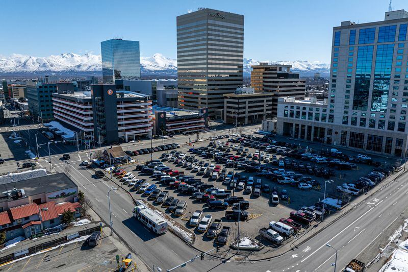 The ConocoPhillips parking lot, adjacent to the existing People Mover transit center, at left, is one of three options under consideration for the future People Mover transit center. (Loren Holmes / ADN)