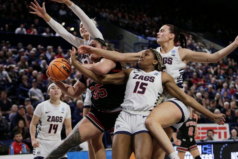 Utah forward Alissa Pili (35) grabs a rebound next to Gonzaga forward Yvonne Ejim (15), forward Maud Huijbens, right, and guard Esther Little during the second half of a second-round college basketball game in the NCAA Tournament in Spokane, Wash., Monday, March 25, 2024. (AP Photo/Young Kwak)