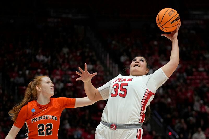 Utah forward Alissa Pili (35) pulls down a rebound as Princeton forward Parker Hill (22) defends in the first half during a second-round college basketball game in the women's NCAA Tournament, Sunday, March 19, 2023, in Salt Lake City. (AP Photo/Rick Bowmer)