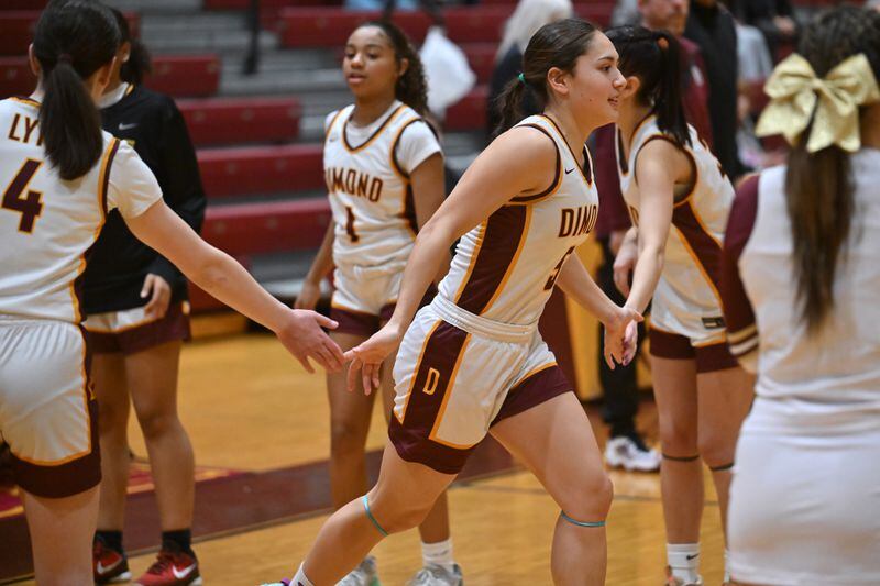 Dimond senior Maile Wilcox takes to the court during starting player introductions before the Lynx's 56-35 home victory over Bettye Davis East High Thunderbirds on Tuesday, Feb. 27, 2024. (Bill Roth / ADN)