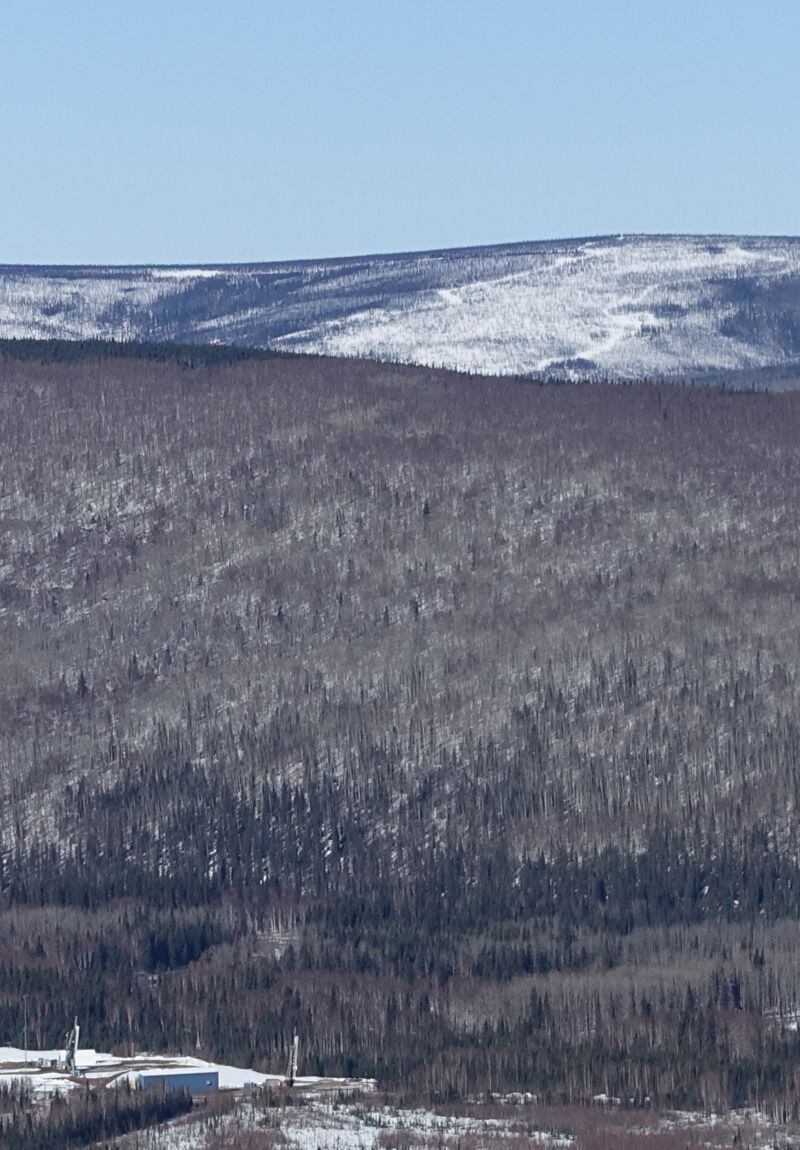 Two sounding rockets, lower left, point toward the sky at Poker Flat Research Range north of Fairbanks. (Photo by Ned Rozell)